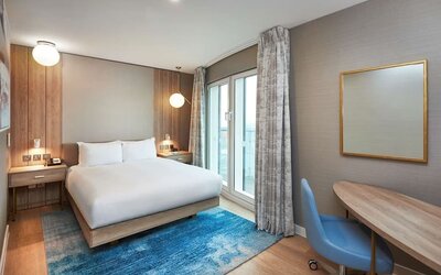 Day use room with work desk and balcony at DoubleTree By Hilton London Excel.