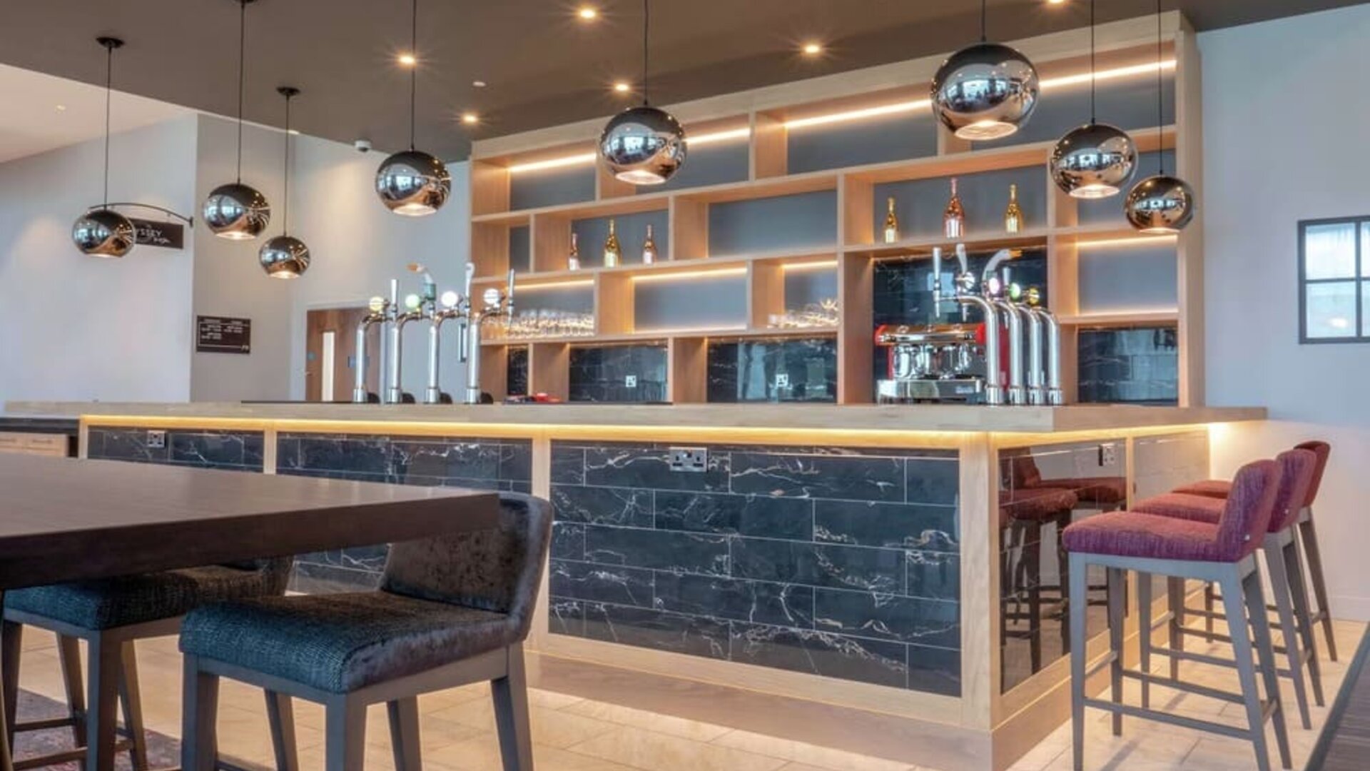 Lobby and coworking lounge at Hilton Garden Inn Birmingham Airport.