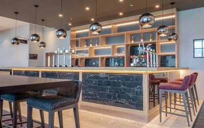 Lobby and coworking lounge at Hilton Garden Inn Birmingham Airport.