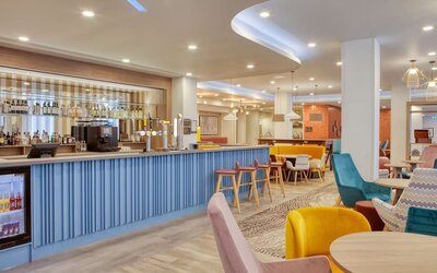 Hotel bar and lounge area at the Hampton by Hilton Manchester Northern Quarter.