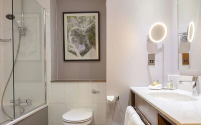 Guest bathroom with shower at DoubleTree By Hilton Edinburgh Airport.