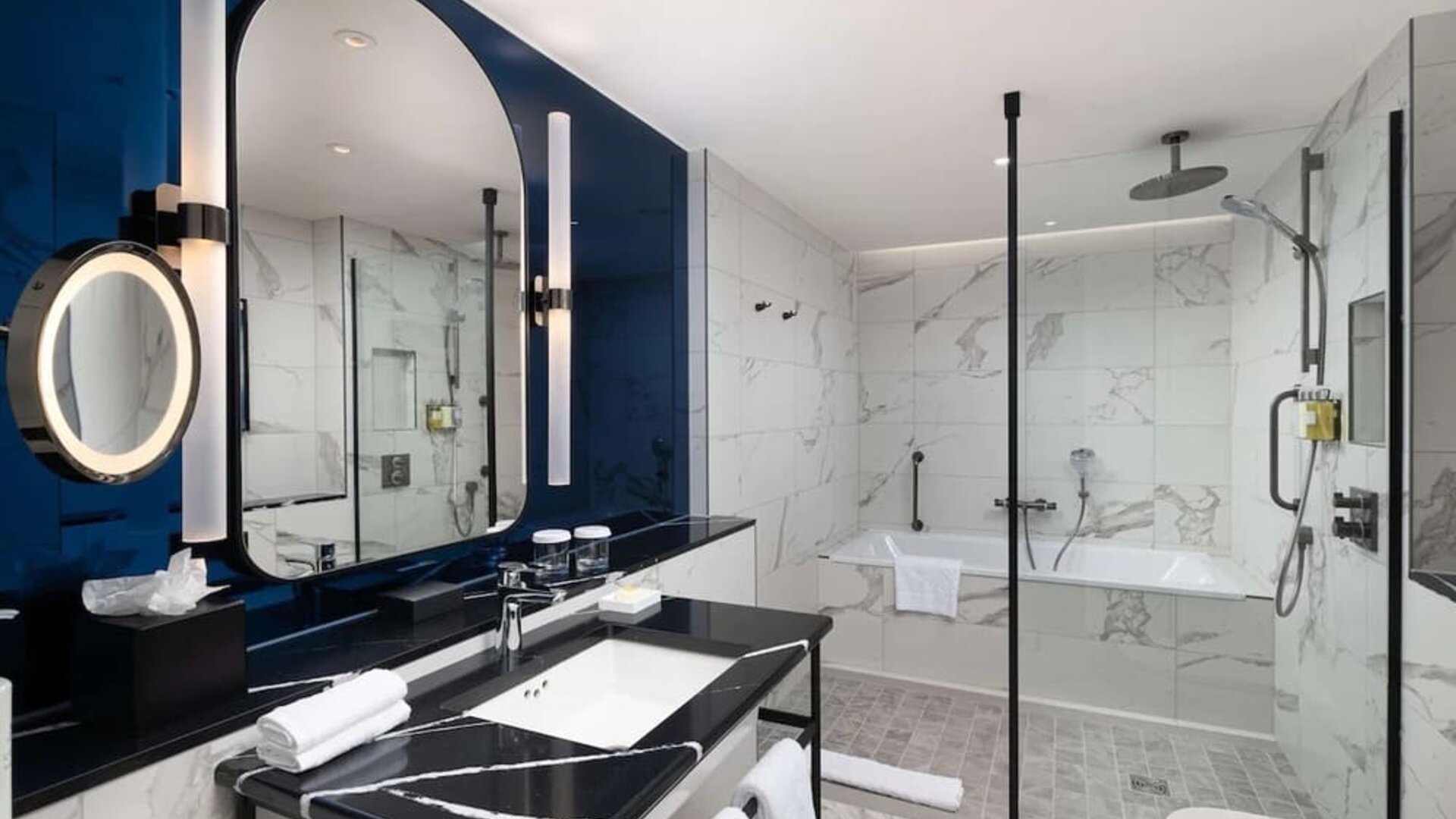Guest bathroom with shower and tub at Lost Property St. Paul's London, Curio Collection By Hilton.