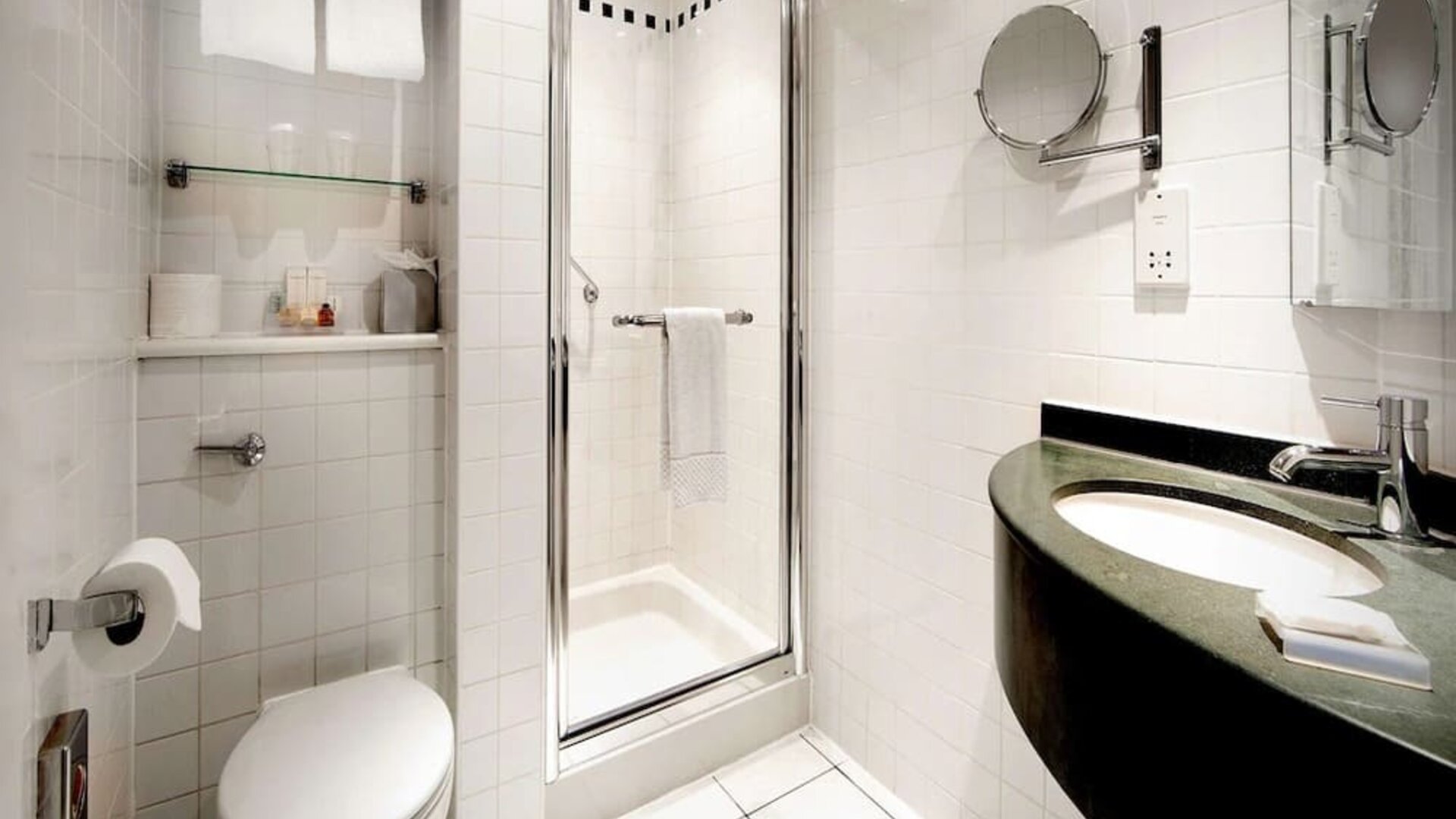 Guest bathroom with shower at Hilton Garden Inn Glasgow City Centre.