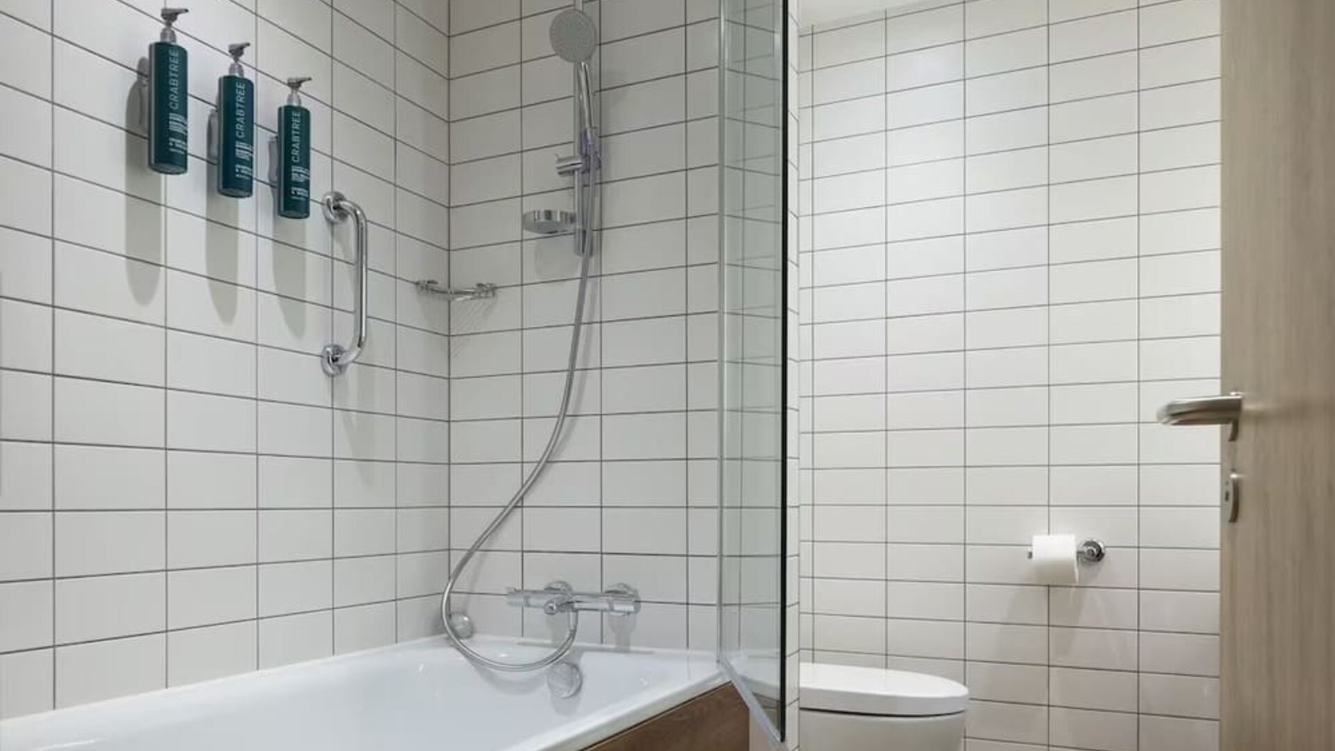 Guest bathroom with shower and tub at Hilton Garden Inn Stoke On Trent.
