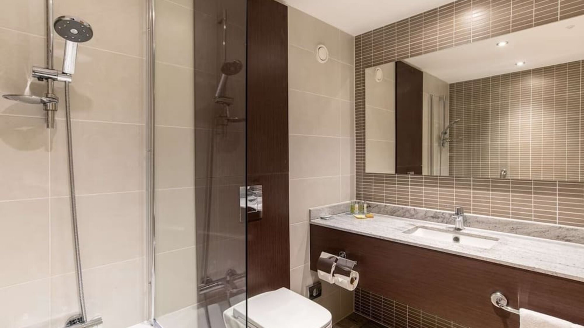 Guest bathroom with shower and free toiletries at the Hilton London Gatwick Airport.