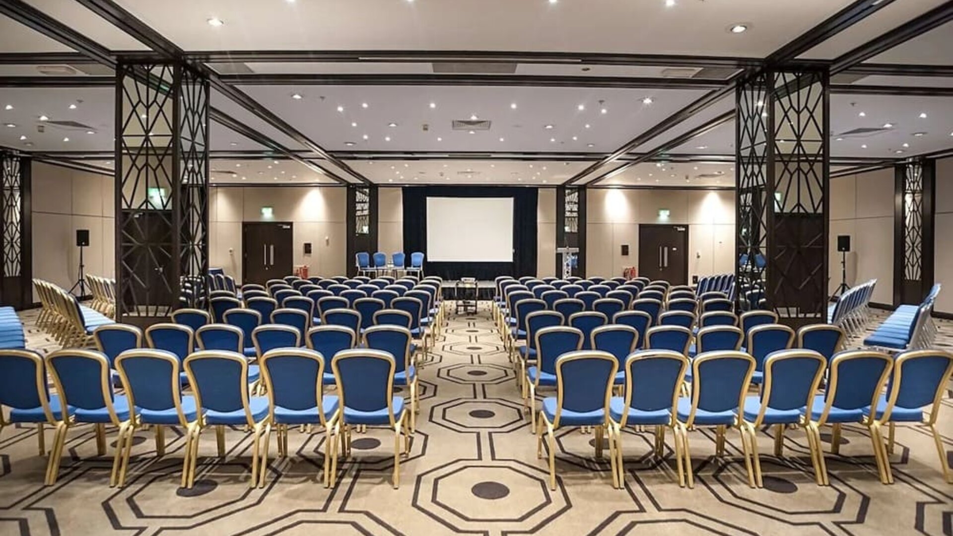 Spacious conference room for large crowds at the Hilton London Gatwick Airport.