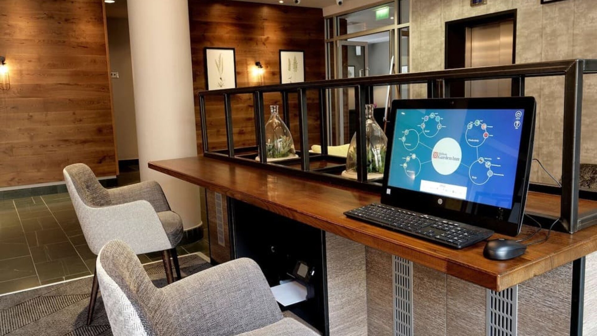 Business center with computer, printer and comfortable mobiliary at the Hilton Garden Inn Birmingham Brindleyplace.