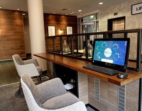 Business center with computer, printer and comfortable mobiliary at the Hilton Garden Inn Birmingham Brindleyplace.