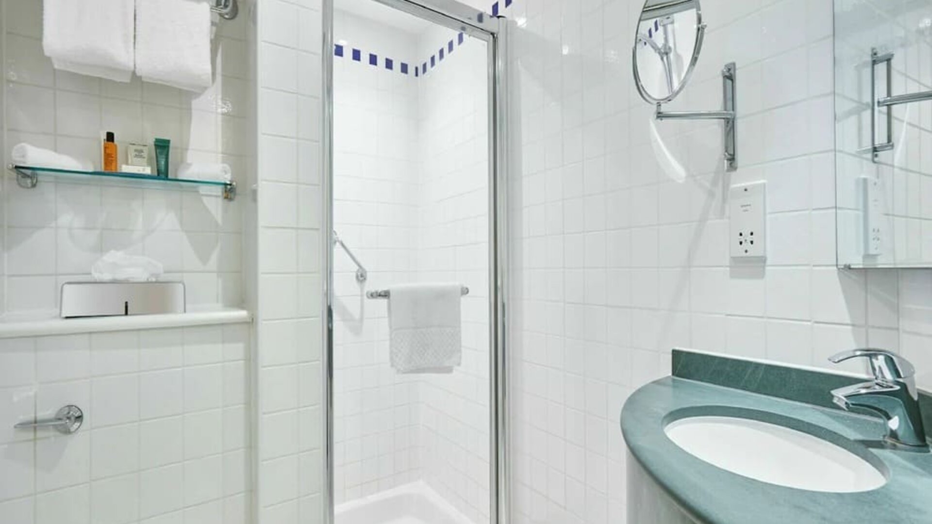 Guest bathroom with shower and toiletries at the Hilton Garden Inn Birmingham Brindleyplace.