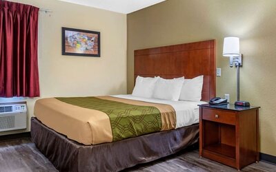 King room at Coratel Inn & Suites By Jasper River Falls.