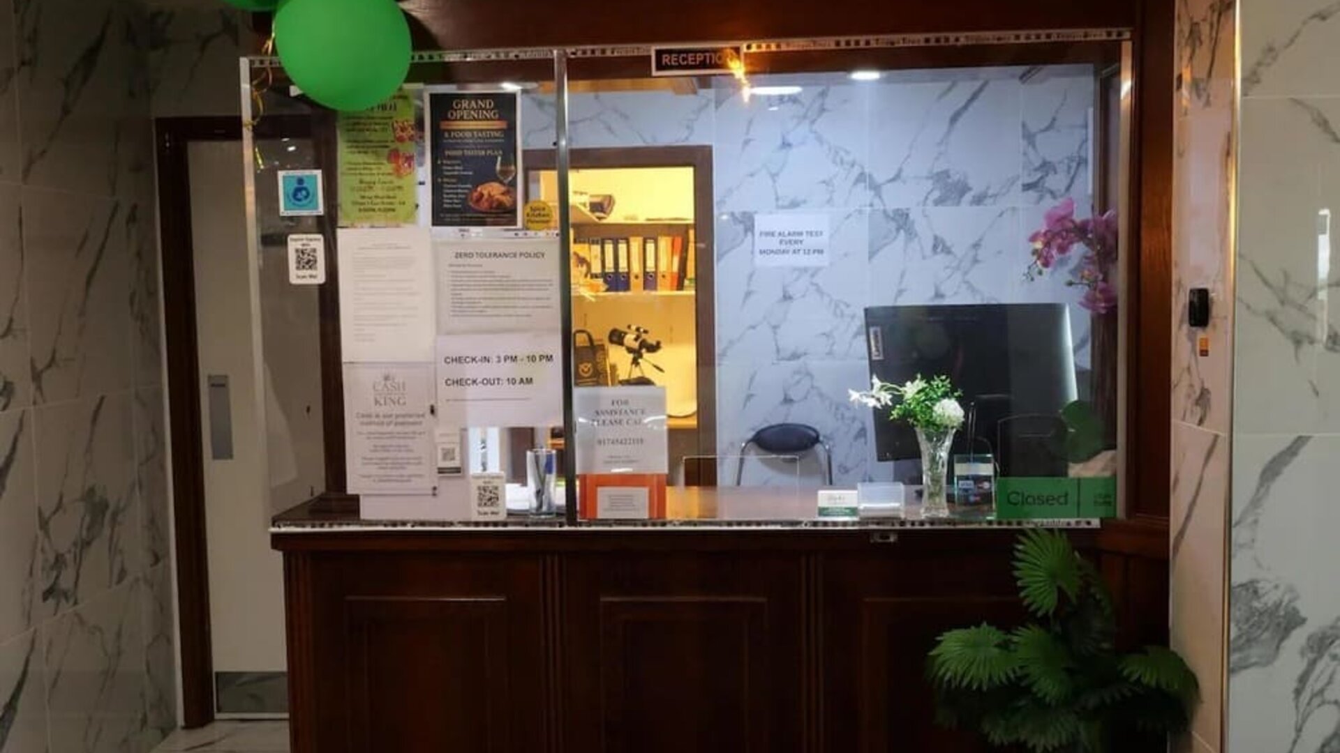Reception desk with front desk services and guest check-in area at Stay Inn Express.