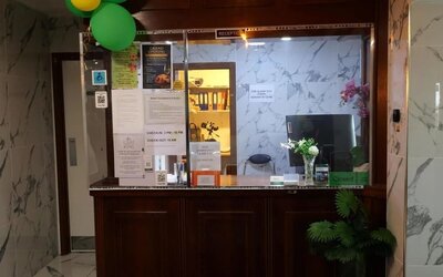 Reception desk with front desk services and guest check-in area at Stay Inn Express.