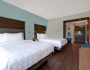 Guest room workspace with desk, flat-screen TV, and comfortable seating at Tru By Hilton Lithia Springs.