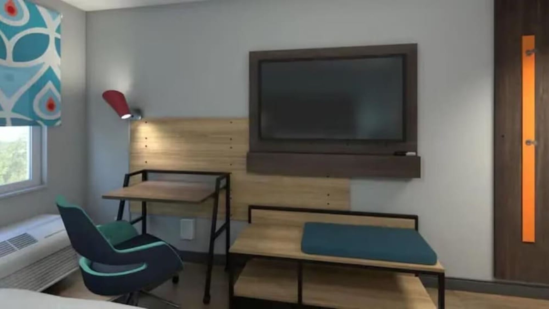 Guest room workspace with desk, lounge seating, flat-screen TV, and modern furnishings at Tru By Hilton Lithia Springs.