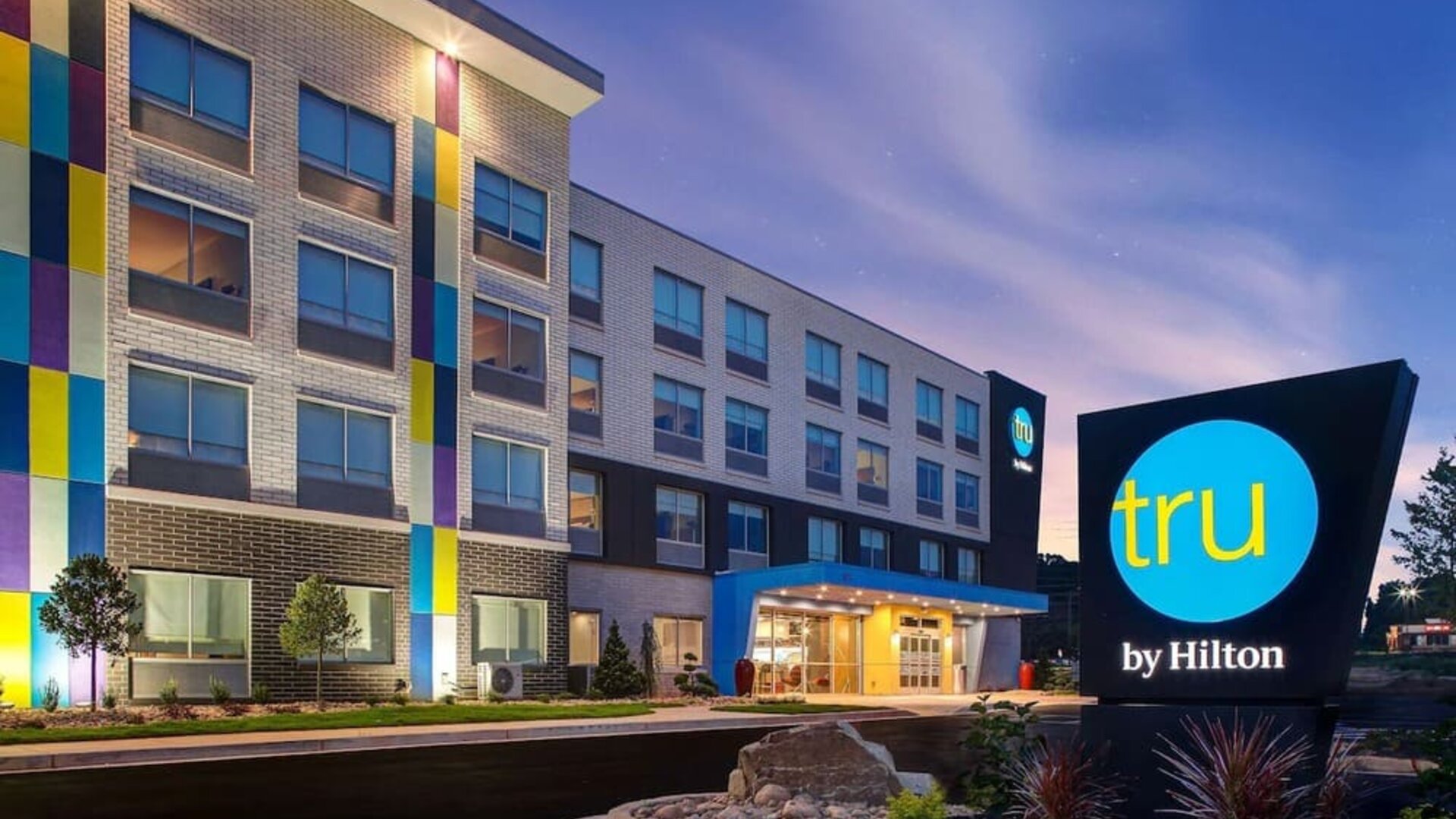 Hotel exterior with modern architecture and welcoming entrance at Tru By Hilton Lithia Springs.