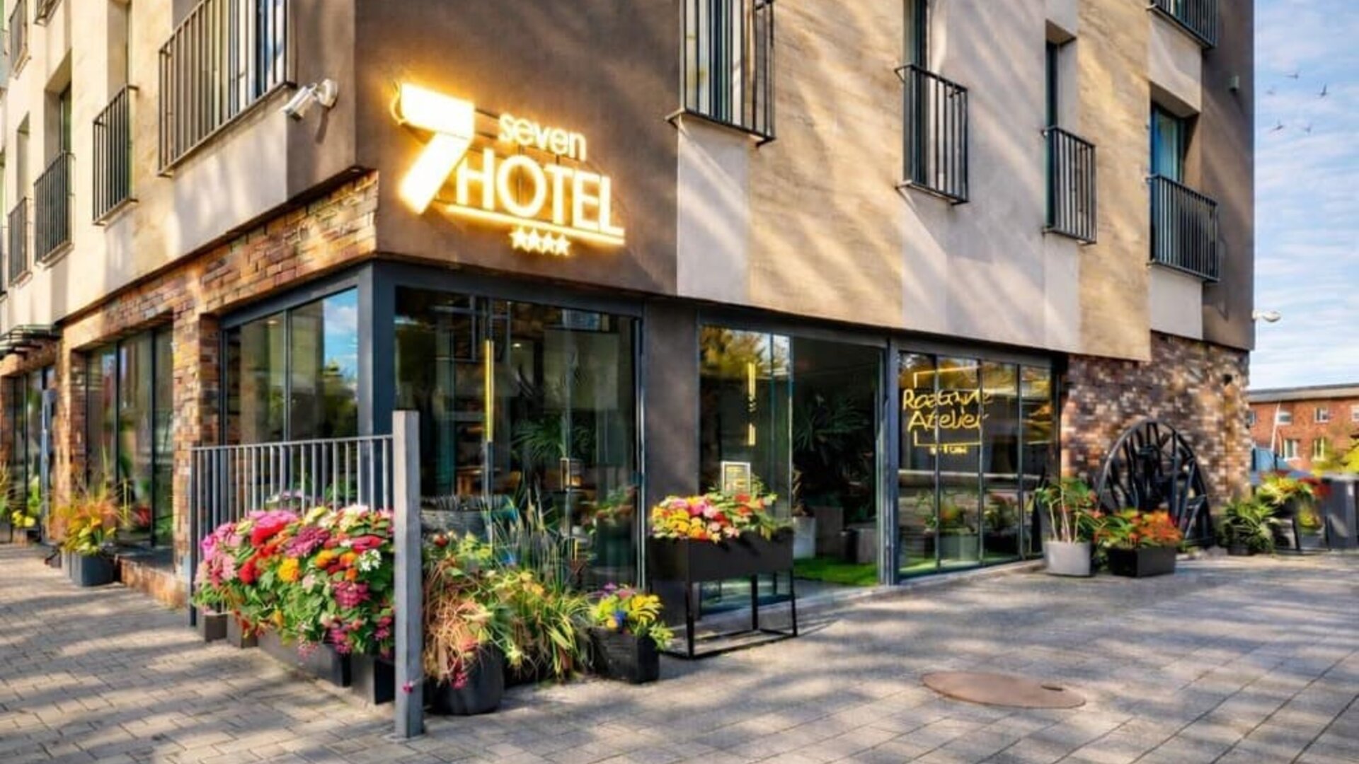 Exterior view of Hotel Seven showcasing its modern architecture and welcoming entrance.