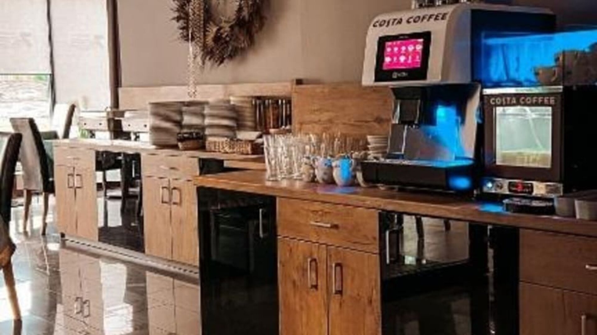 Self-service coffee station with Costa Coffee machine in the breakfast area at Hotel Seven.