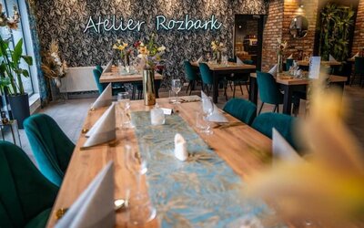 Contemporary dining area with botanical décor, wooden tables and stylish seating at Hotel Seven.