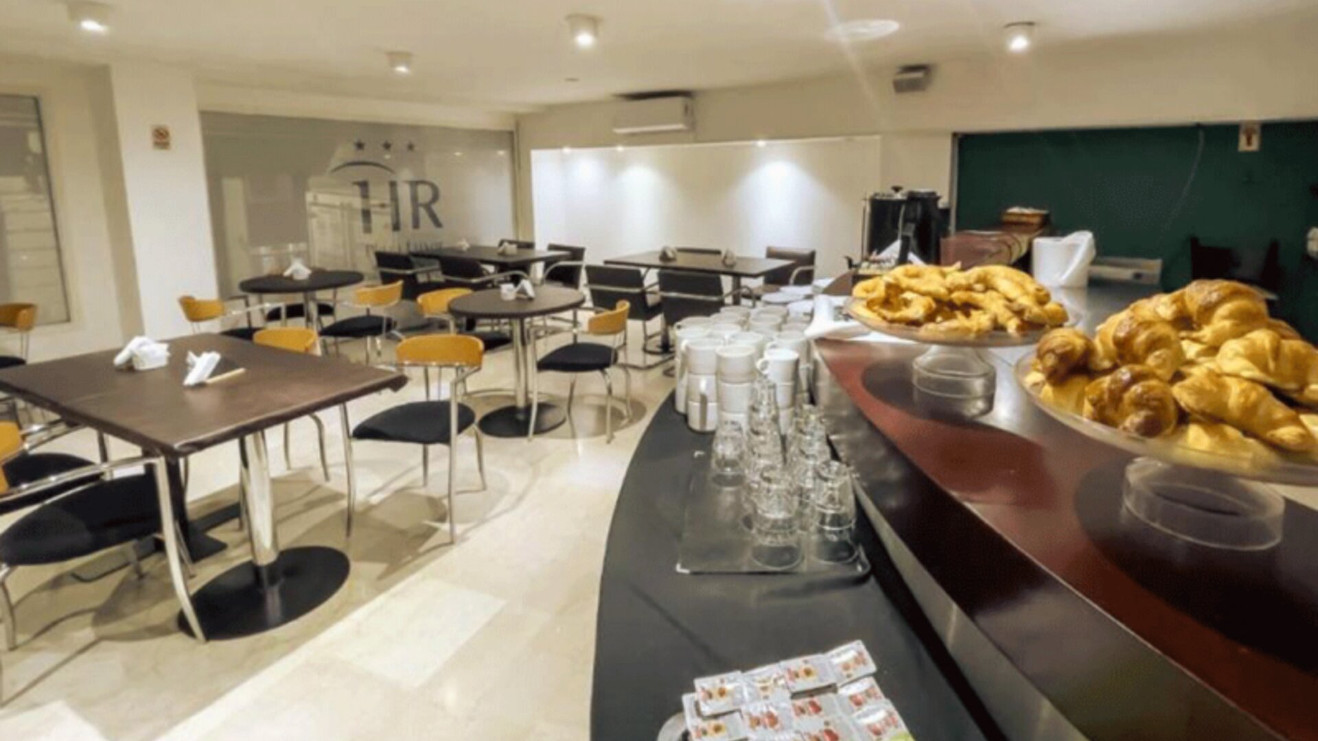 Bright breakfast and dining area offering comfortable seating and a buffet setup where guests can enjoy daily meals and refreshments at HR Plaza Luxor.
