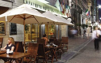 Outdoor café terrace at Hotel Lafayette overlooking a lively pedestrian street, offering al fresco dining in the heart of the city at Hotel Lafayette.