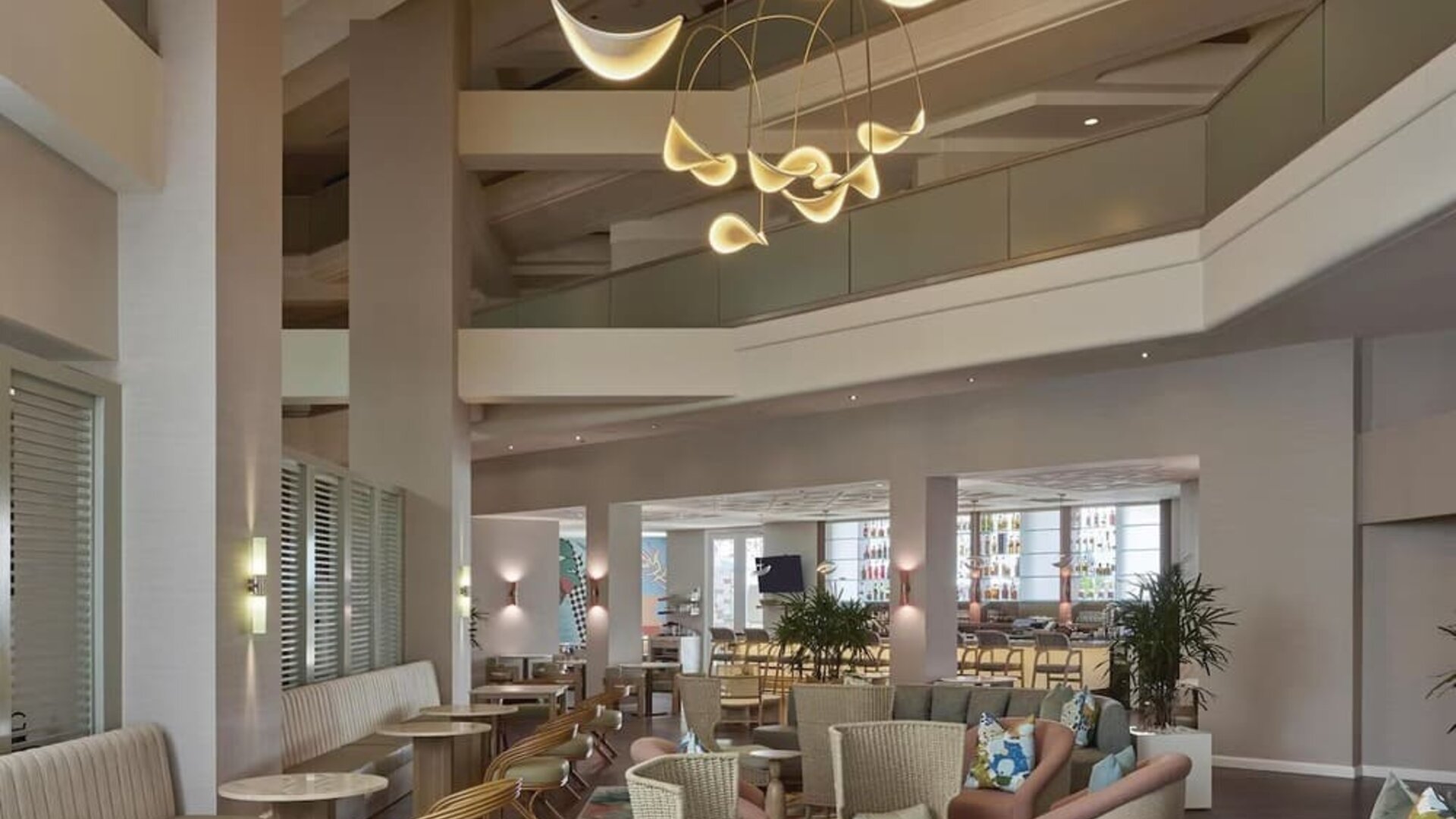 Contemporary hotel lobby featuring stylish lounge seating, modern lighting, and an inviting social atmosphere at Hyatt Centric Delfina Santa Monica.