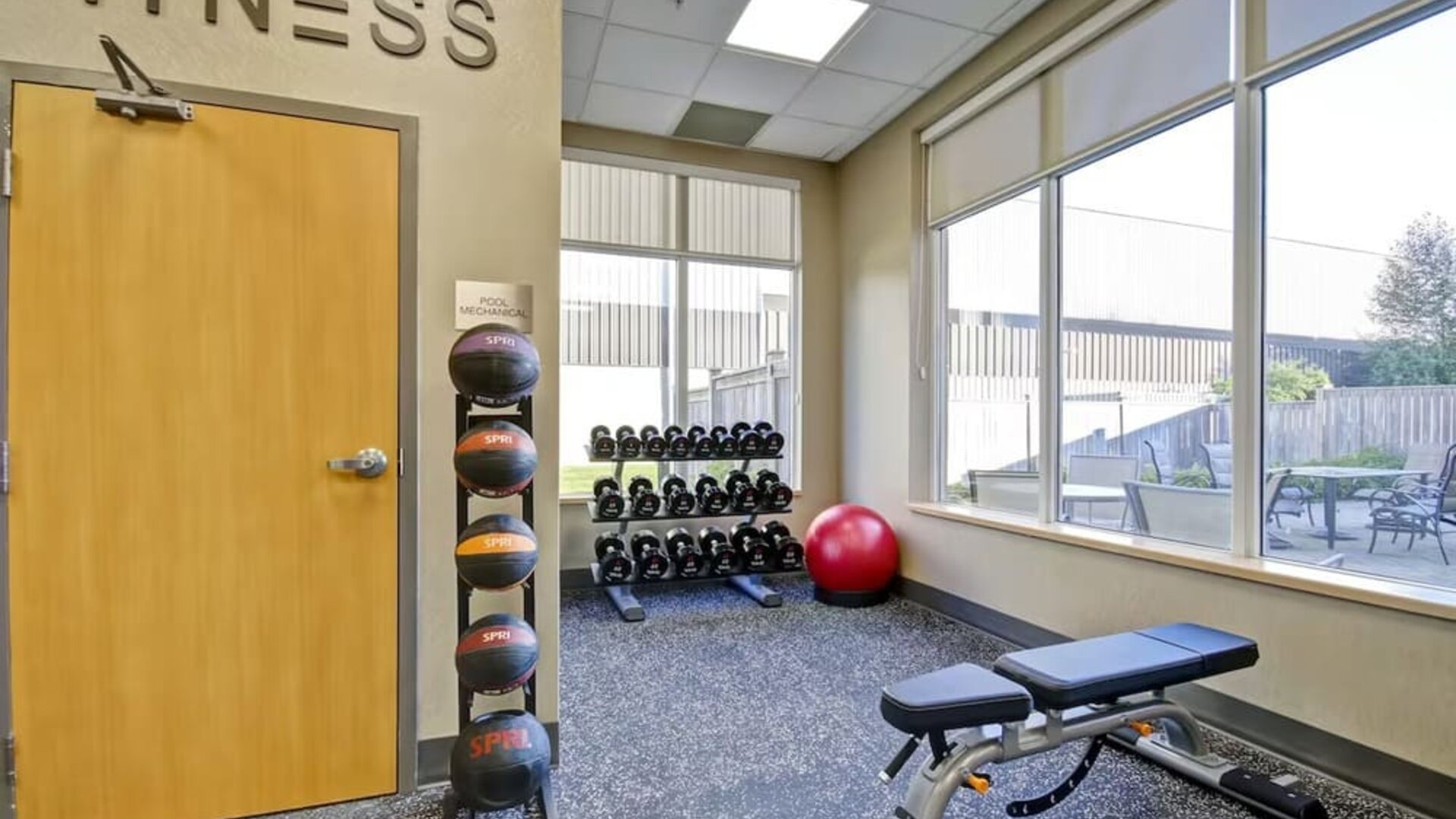 Modern fitness center featuring cardio equipment, free weights, and strength training machines at Fairfield Inn & Suites Guelph.
