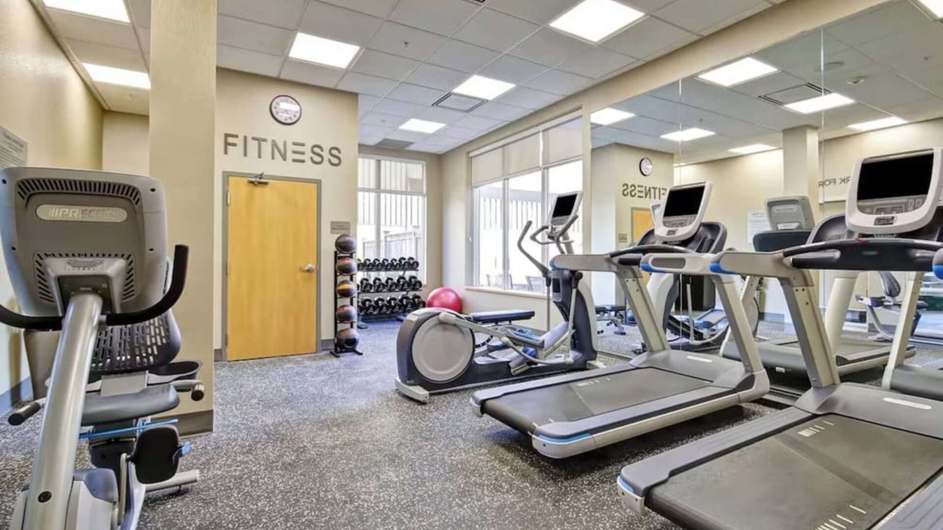 Well-equipped fitness center with treadmills, elliptical machines, and cardio equipment at Fairfield Inn & Suites Guelph.