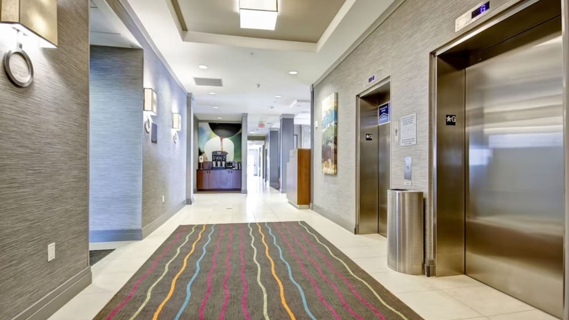 Modern hotel corridor with elevator access and contemporary interior design at Fairfield Inn & Suites Guelph.