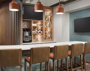 Modern hotel bar featuring handcrafted cocktails, premium spirits, comfortable seating, and a welcoming atmosphere at Hyatt Place Scottsdale/Old Town.