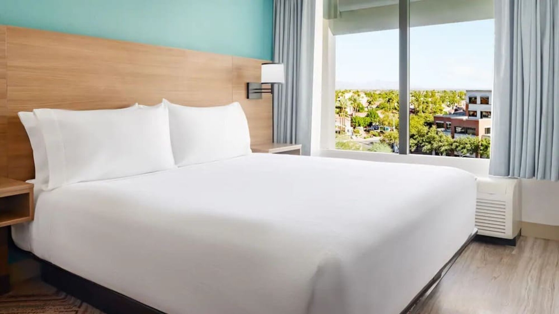 Spacious king guest room featuring a plush king bed, large windows, modern furnishings, and scenic Scottsdale views at Hyatt Place Scottsdale/Old Town.