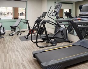 Modern fitness center equipped with cardio machines, free weights, and strength-training equipment at Hyatt Place Scottsdale/Old Town.