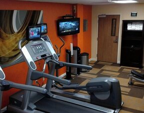 Fitness center featuring modern cardio machines, free weights, and workout equipment for guest use at Courtyard Riverside UCR/Moreno Valley Area.