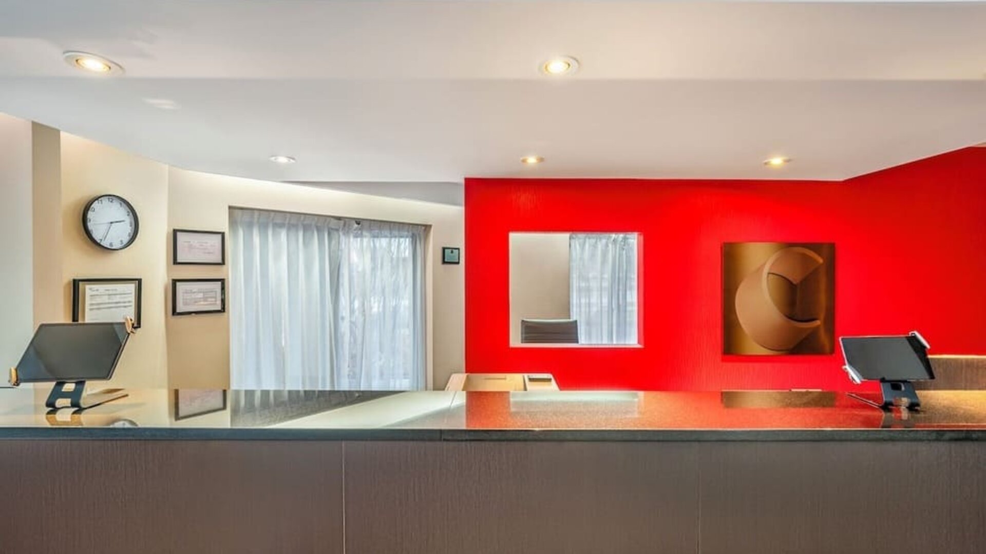 Front desk reception area providing friendly service and convenient guest check-in at Comfort Inn Sherbrooke.