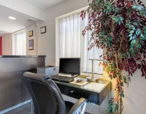 Business center with a desktop computer, printer, and workspace available for guest use at Comfort Inn Sudbury Regent Street.