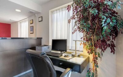 Business center with a desktop computer, printer, and workspace available for guest use at Comfort Inn Sudbury Regent Street.
