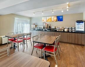 Bright breakfast area with comfortable seating and a complimentary hot breakfast served daily at Comfort Inn Sudbury Regent Street.