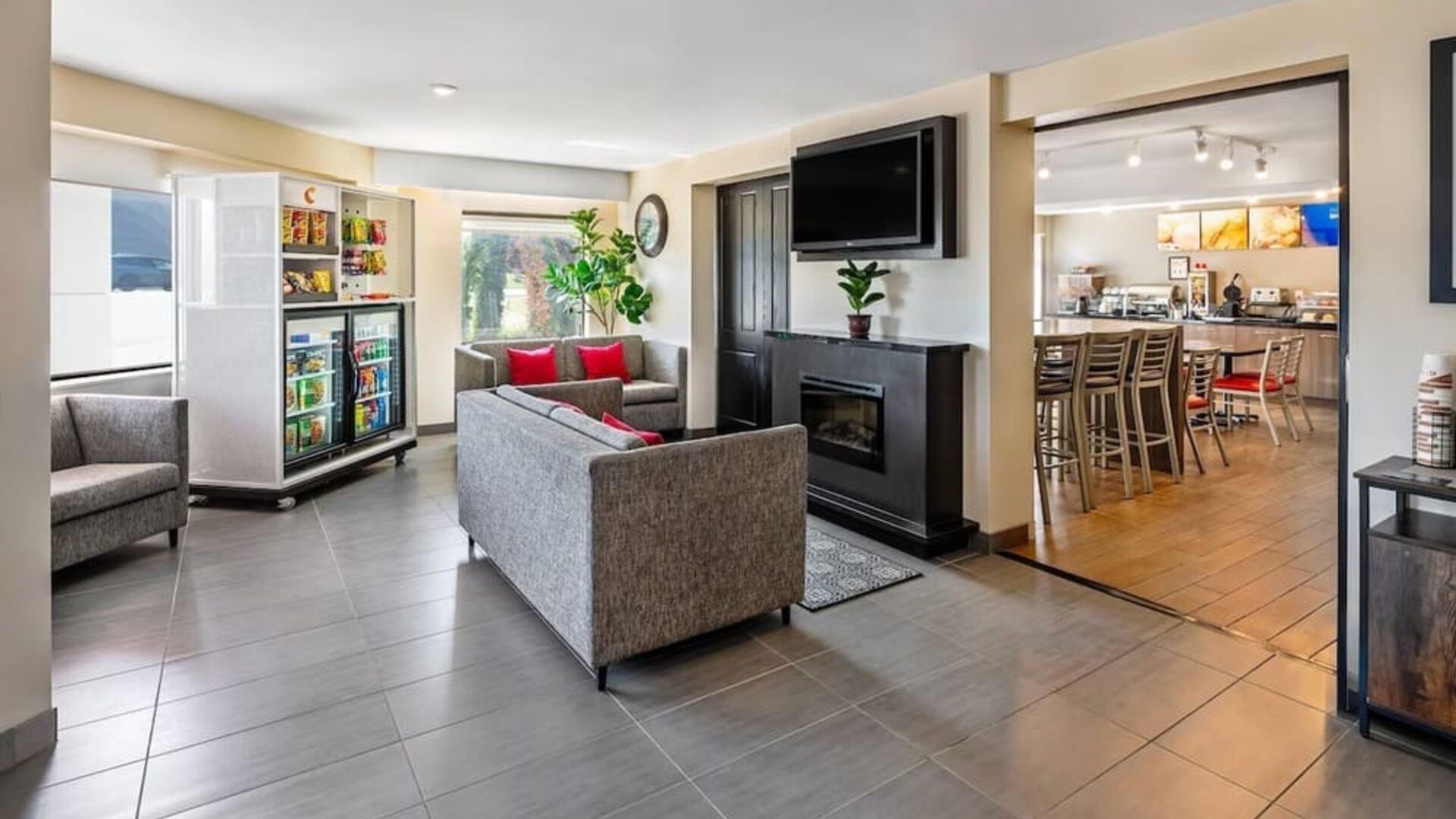 Lobby seating area with comfortable sofas and a snack market for guest convenience at Comfort Inn Sudbury Regent Street.