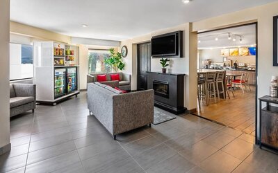 Lobby seating area with comfortable sofas and a snack market for guest convenience at Comfort Inn Sudbury Regent Street.