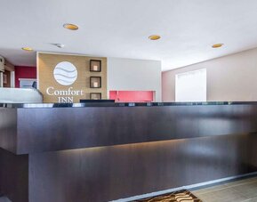 Front desk and reception area welcoming guests at Comfort Inn Sudbury East.