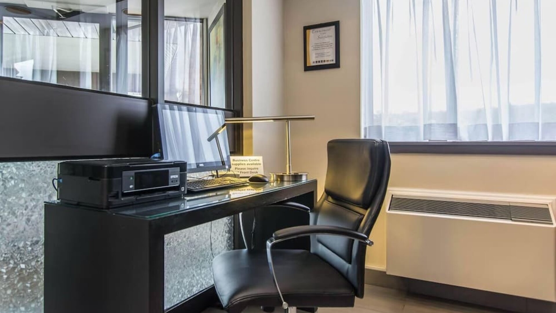 Business center with a desktop computer and printer at Comfort Inn New Glasgow.