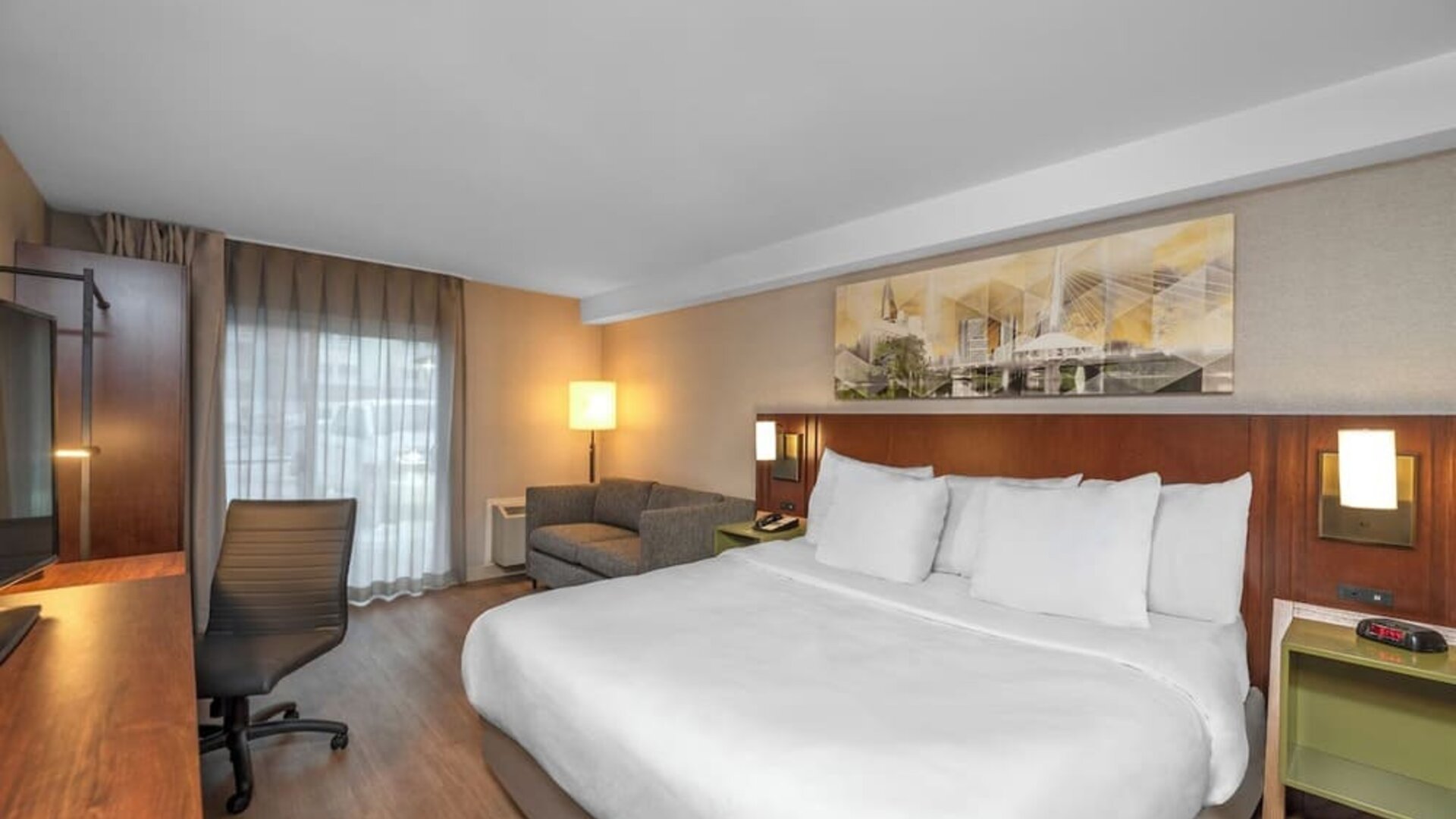 King guest room with a work desk at Comfort Inn Sault Ste. Marie.
