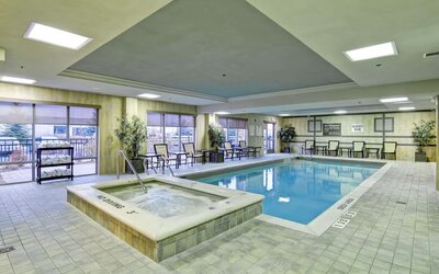 Indoor swimming pool and hot tub at Hampton Inn & Suites By Hilton Guelph.