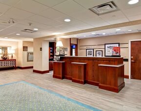 Hotel reception desk at Hampton Inn & Suites By Hilton Guelph.