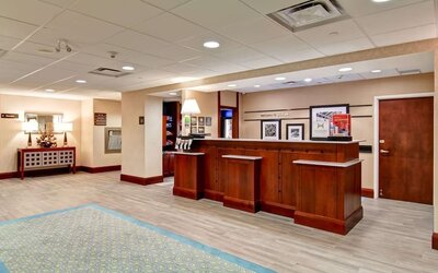 Hotel reception desk at Hampton Inn & Suites By Hilton Guelph.