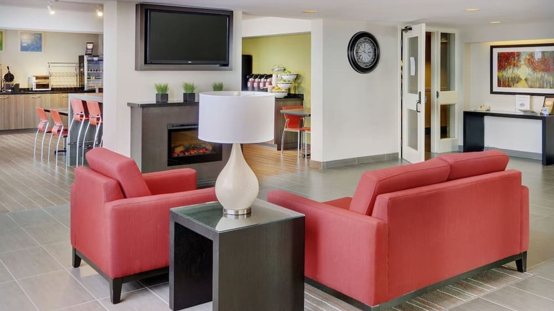 Hotel lobby with fireplace and lounge seating at Comfort Inn Brandon.