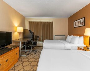 Guest room with two queen beds and a work desk at Comfort Inn Brandon.