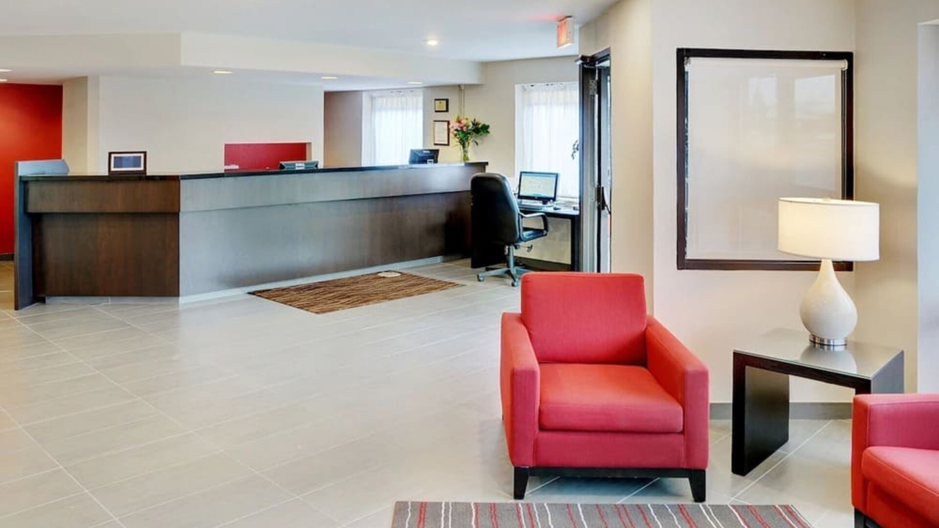 Hotel lobby with reception desk and seating area at Comfort Inn Brandon.