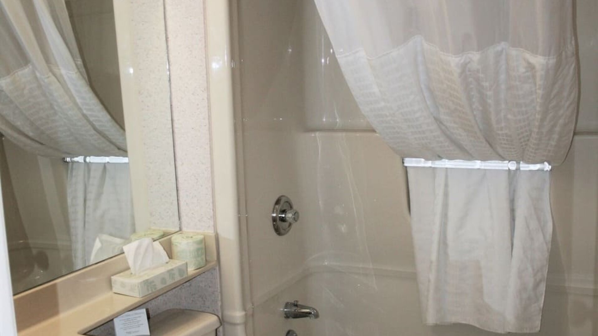 Guest bathroom with a bathtub and shower combination at Comfort Inn Swift Current.