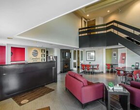 Hotel lobby with seating area and reception desk at Comfort Inn Swift Current.