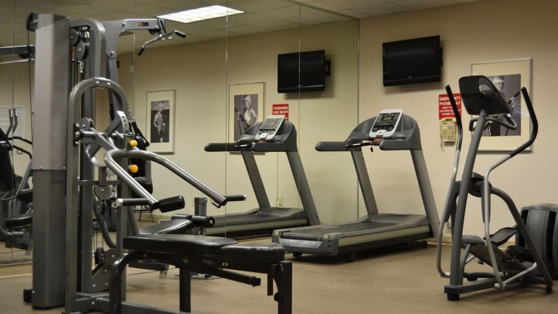Fitness center with cardio and strength-training equipment at Amenida Residences.